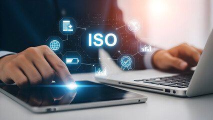 Iso standards compliance concept with businessman using tablet and laptop technology