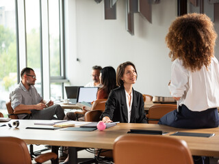 Business Team Casually Talking In Open Office 