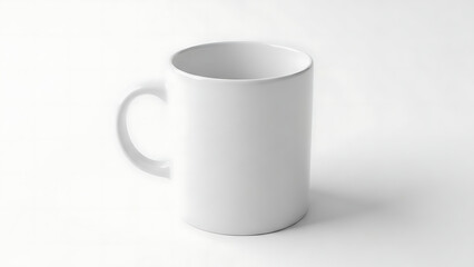 Obraz premium A plain white ceramic mug on a white background.
