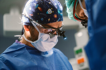 Surgeon performing surgery in operating room during medical procedure