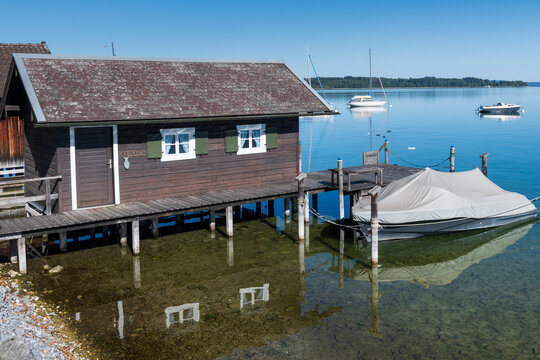 Traditional Bavarian Boathouse on Crystal Clear Lake