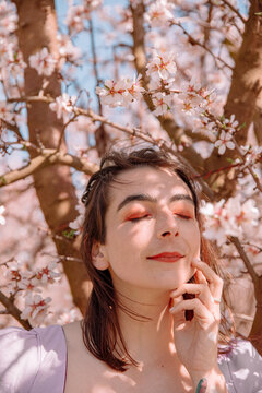 Woman with almond blossoms