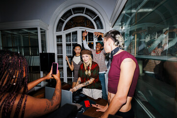 Friends enjoying live music and dancing at party