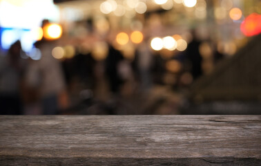 Empty wood table top and blur of restaurant background selective focus product display