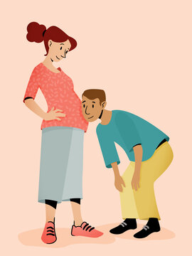Expecting couple listening to unborn baby in belly