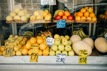 Fresh Fruit Display in Local Market During Sunny Afternoon