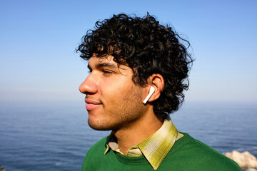 Profile of a man by the ocean