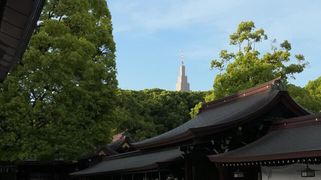Meiji Jingu Shrine in Tokyo, Japan NTT Docomo Yoyogi Building visible in the background