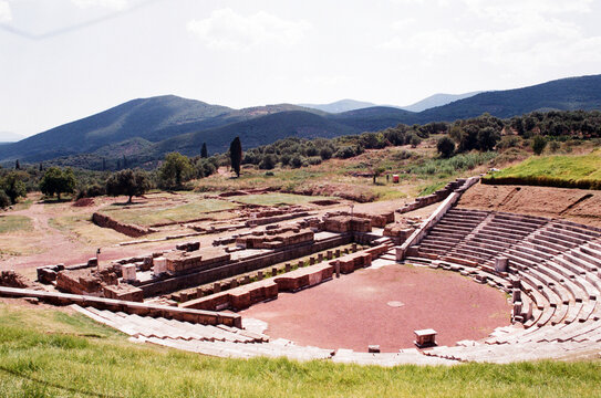 Ancient Theater Ruins in a Serene Landscape Near Mountains
