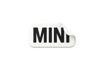 White sticker with mini text featuring a peeled corner