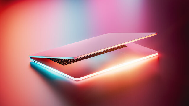 Laptop glows with vibrant neon lights in a dark setting