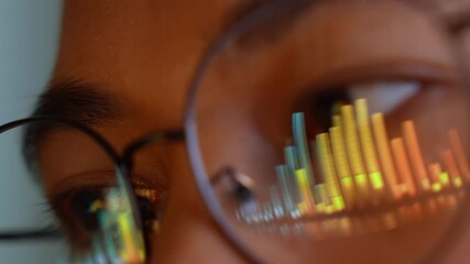 A person wearing glasses uses a laptop, with vibrant real-time digital data graphs reflected in the lenses. This image symbolizes analytics, data-driven decision-making, technology, the digital era.
- Powered by Adobe