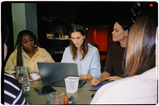 A team meeting in a coworking office of a women-led digital startup