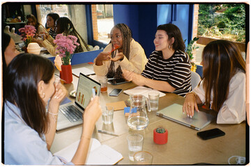 Team of women entrepreneurs discussing a presentation