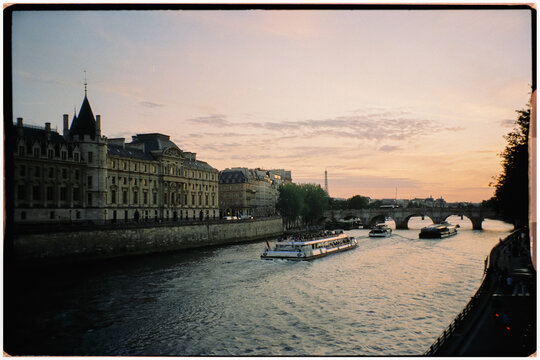Analog panoramic view of the Seine River in Paris with boats