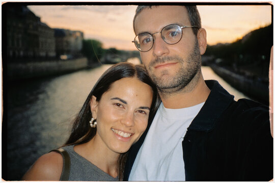 Analog self-portrait with direct flash of couple over the Seine River