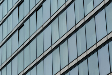 Modern office building glass facade showing geometric pattern