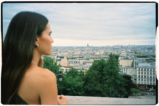 Film shot of a tourist enjoying the view of Paris from Montmartre Hill