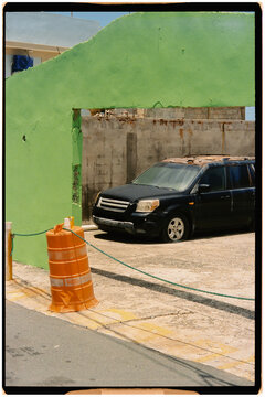 Analog street photograph showing an abandoned truck in La Perla