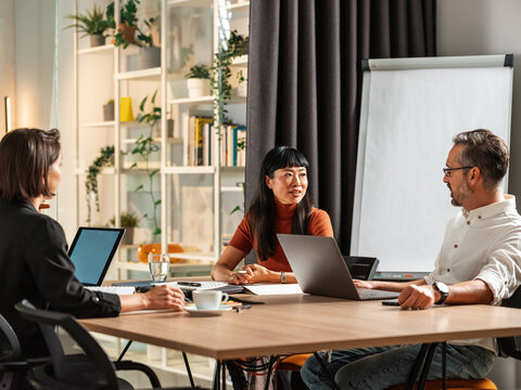 Business Meeting With Team Members Discussing Ideas 