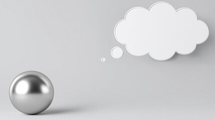 A silver ball is sitting on a grey surface