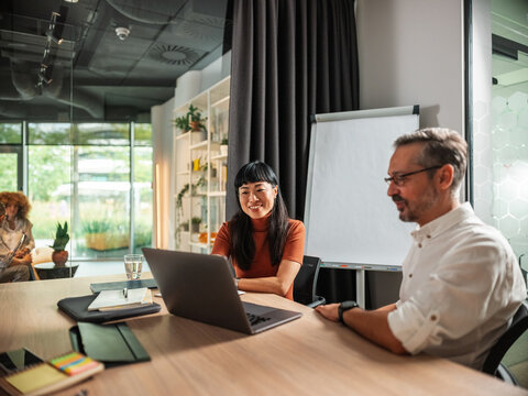 Virtual Business Meeting With Laptop,  And Co-Workers 