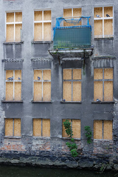 Barricaded windows on an old house