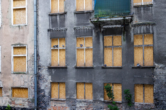 Barricaded windows on an old house