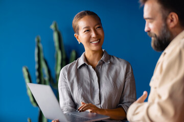 Warm Business Meeting Between Colleagues With Laptop