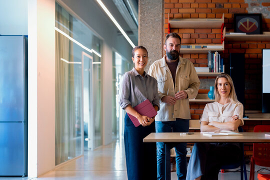 Group Portrait of Three Colleagues at an Office