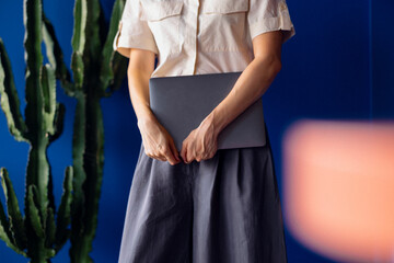 Businesswoman Holding a Laptop, a Close Up