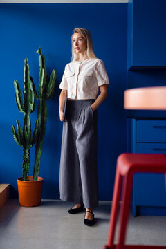 Businesswoman in Modern Blue Office Setting 