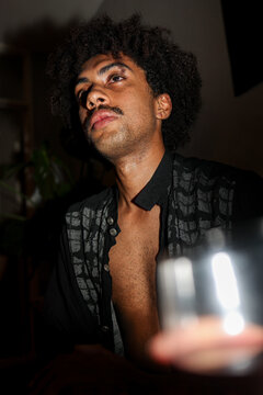 Young black Man Posing With a Glass in Hand