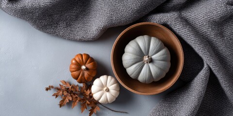 Fototapeta premium Cozy autumn thanksgiving decor with pumpkins in a rustic bowl warm indoor environment captivating still life arrangement