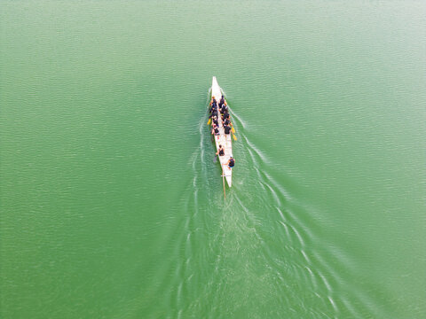 Dragon Boat Racing Team on Green Water