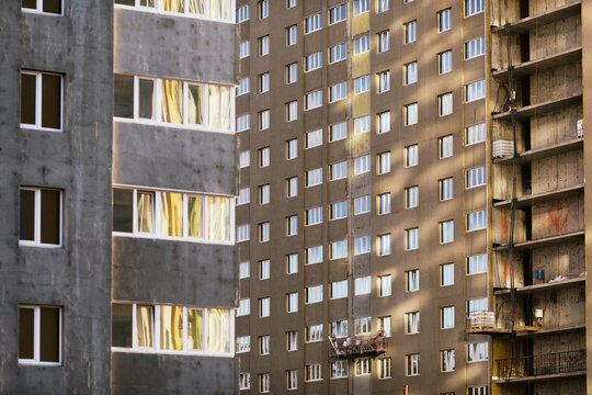 New Apartment Buildings in Urban Construction Site With Scaffolding