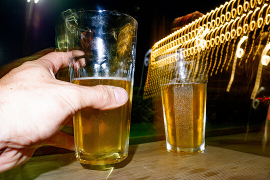 Cheerful Night With Drinks and Vibrant Lights at a Bar Gathering