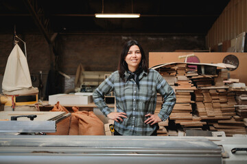 Confident Latina Carpenter in Workshop