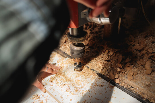 Drilling Wood Panel in Artisan Workshop