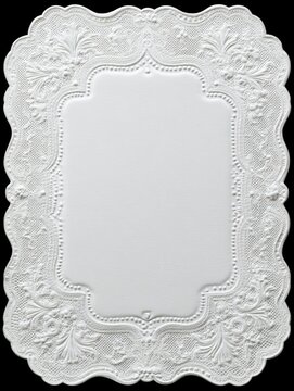 White oval lace doily with delicate elegant floral embroidery border on black background	