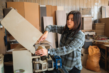 Latina Carpenter Repairing Veneer Machine