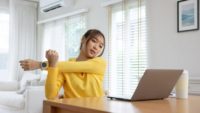 Gen Z workforce work hybrid workplace. Young adult asia people sit learn from online study class at home digital nomad stretch arm stiff neck pain yoga self care body relax stress relief break time.
