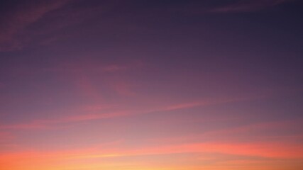 A serene sunset sky timelapse featuring soft cirrus and altostratus clouds glowing in gentle pink and orange layers as evening light fades, capturing smooth cloud movement across dusk. Time-lapse.
 - Powered by Adobe
