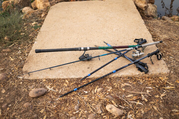 Fishing rods on the ground by a river in nature