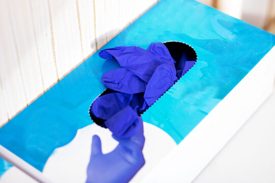 Medical glove handling, Closeup of medical professional getting gloves ready for procedure - Powered by Adobe
