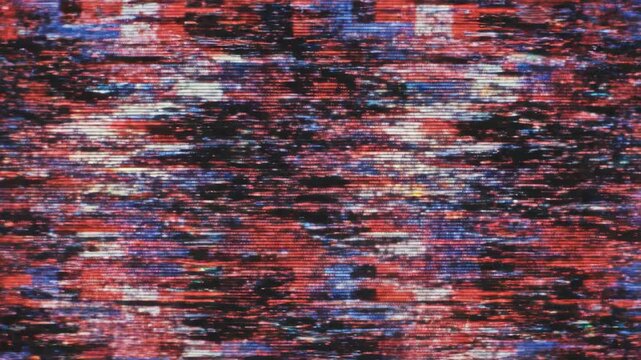 Rapidly flickering digital signal corruption with horizontal tearing geometric lines in red and blue static, streaming, transition