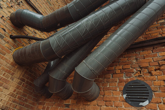 Air pipes on a brick wall