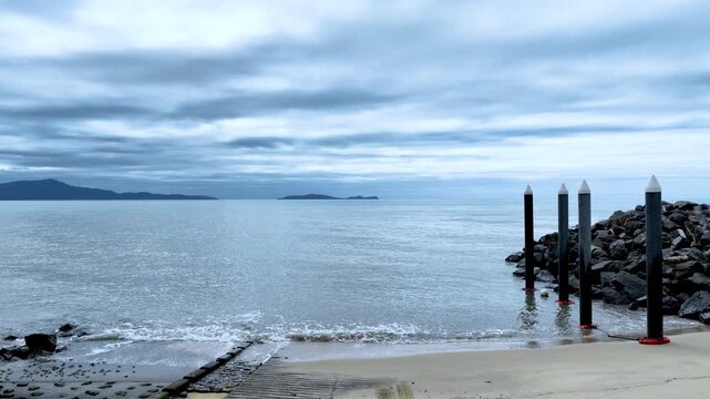 Slow Forward Motion Over Tropical Boat Ramp to Ocean Horizon