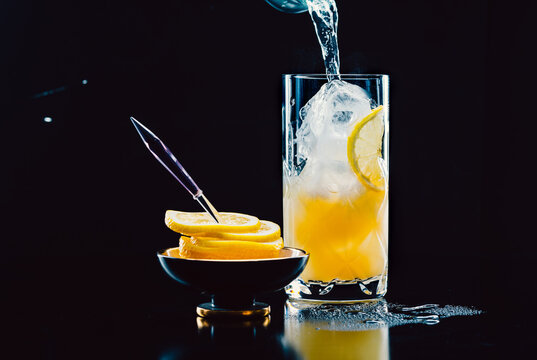 Refreshing citrus drink with ice and lemon slices