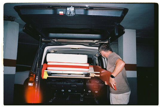 Man Loading Mattress and Furniture
